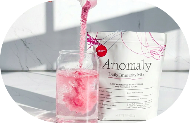 Anomaly Berry mix being poured into a glass of water