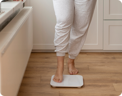 Person standing on a scale at home