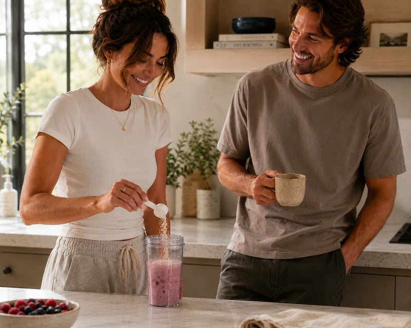 Couple making Anomaly smoothies together in the kitchen